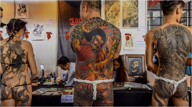 Tattoo- fans -show- off- their -extreme bodywork- at international -festiva-l in- China celebrating- the- art